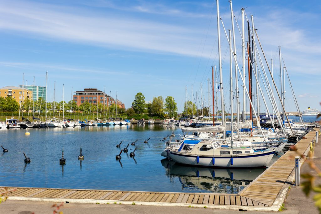 Scenic view of Copenhagen port Langelinie marina with many moored docking yachrs and sailboats and